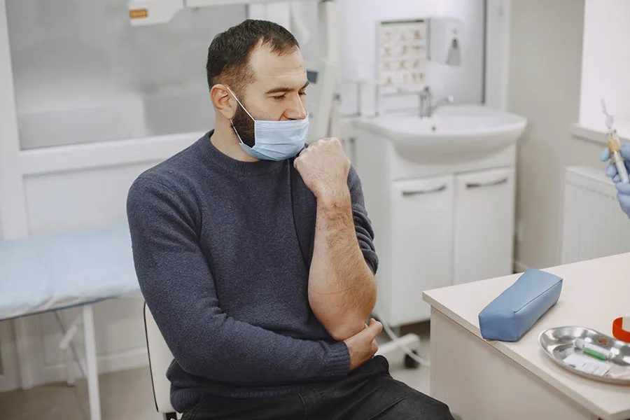 Laboratory-Testing-skillful-nurse-is-doing-blood-test-for-man-in-clinic-man-in-medical-mask-Tampa-Florida